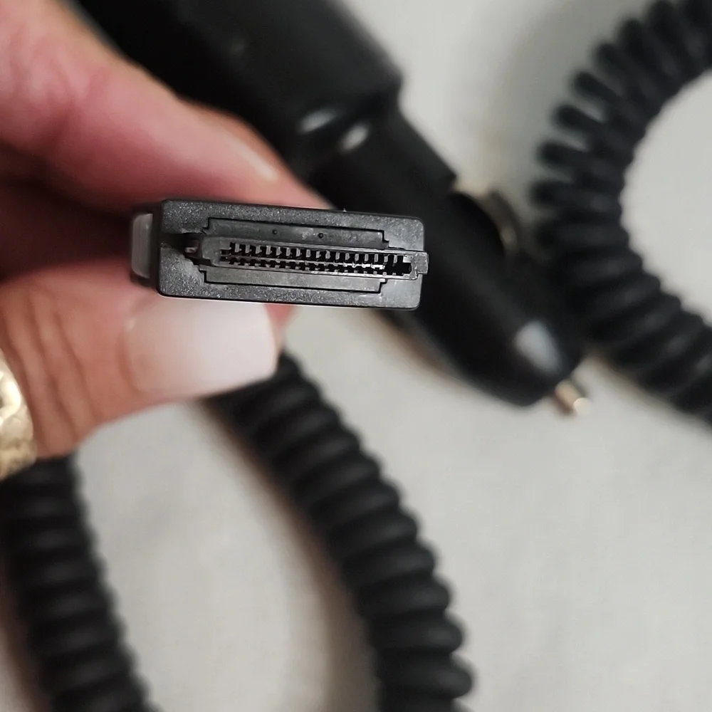 Assorted Vintage Electronic Charging Cables and Cases